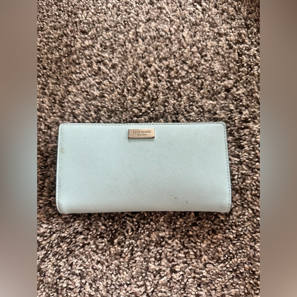 kate spade light blue wallet with gold plaque